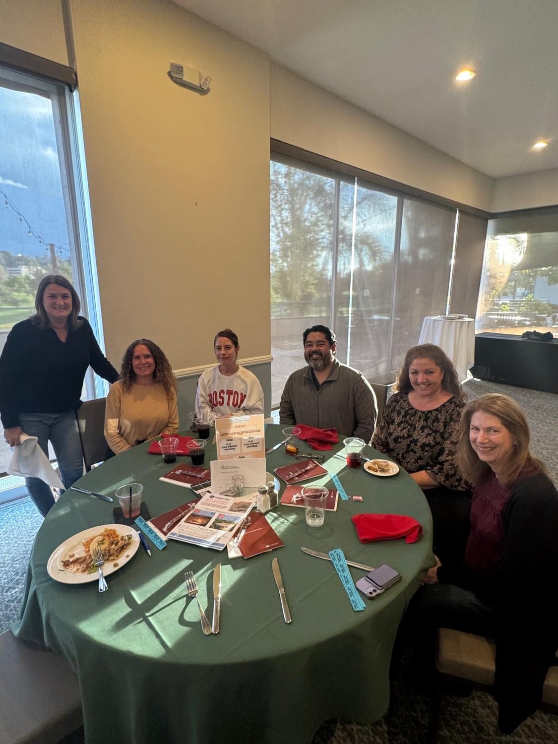 Members around a table at a member meeting