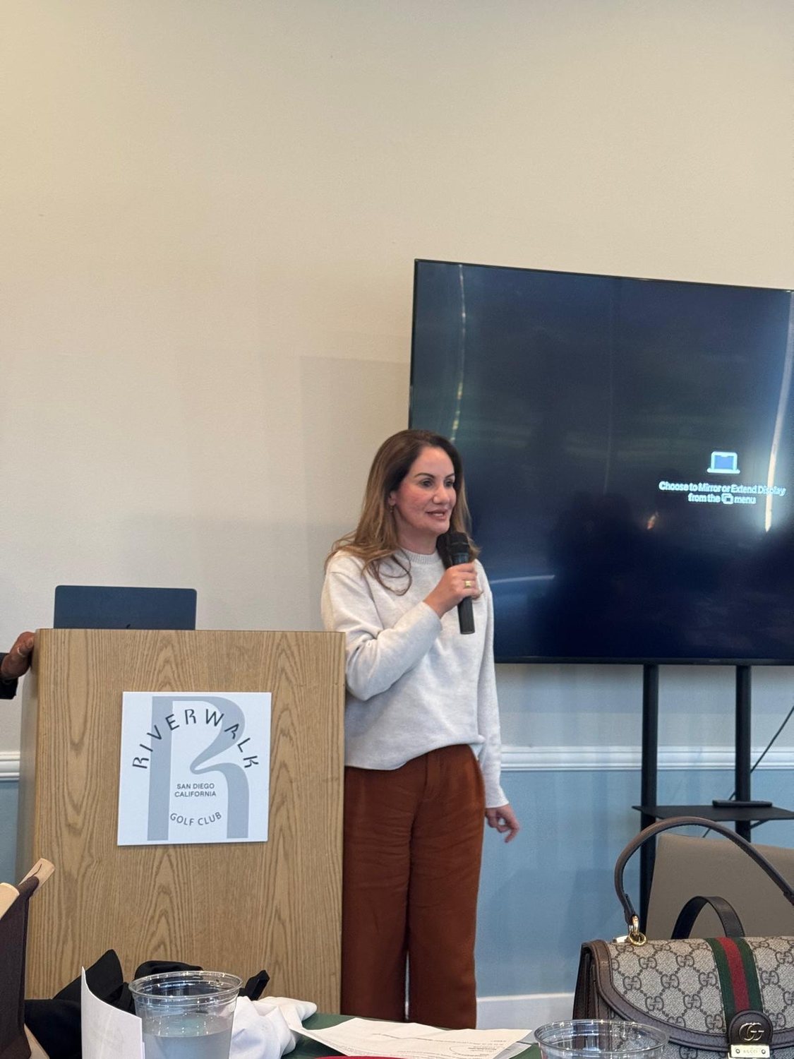 Speaker at the podium during a member meeting